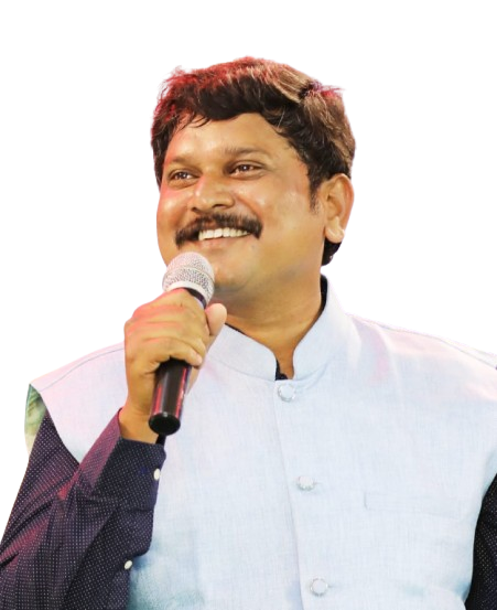 Dr. S. D. Kalaiamudhan speaking on stage with a microphone